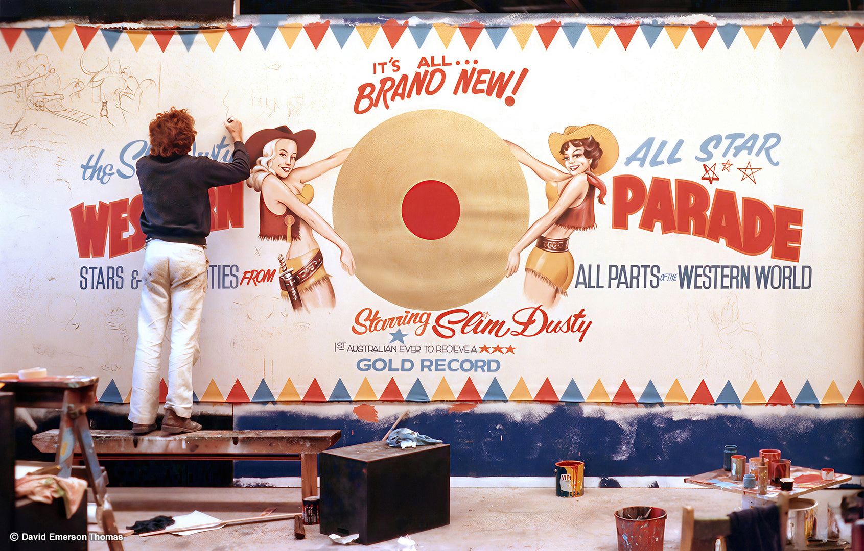David in Action Painting a Mural for The Slim Dusty Movie (1984) scenic paint on canvas (10 metres wide) by Australian artist David E Thomas, 1983. Theatrical Props Studio in Port Melbourne, Victoria, Australia