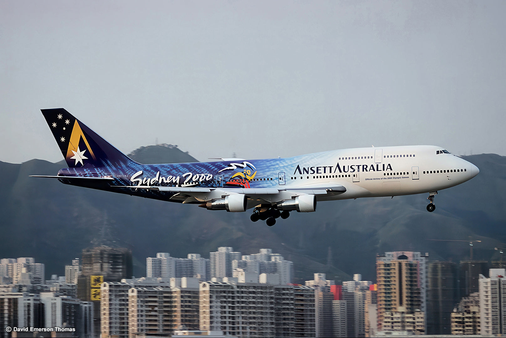 Hand-Painted Plane Livery for the Sydney 2000 Olympics (Flying High 01) 2-pack aircraft paint, sprayed by Australian artist David E Thomas, 1999. Hong Kong, China - Over the now-closed Kai Tak International Airport (VHHH)