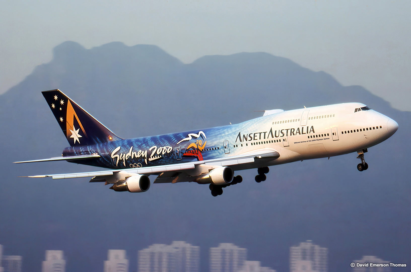 Hand-Painted Plane Livery for the Sydney 2000 Olympics (Flying High 02) 2-pack aircraft paint, sprayed by Australian artist David E Thomas, 1999. Hong Kong, China - Over the now-closed Kai Tak International Airport (VHHH)