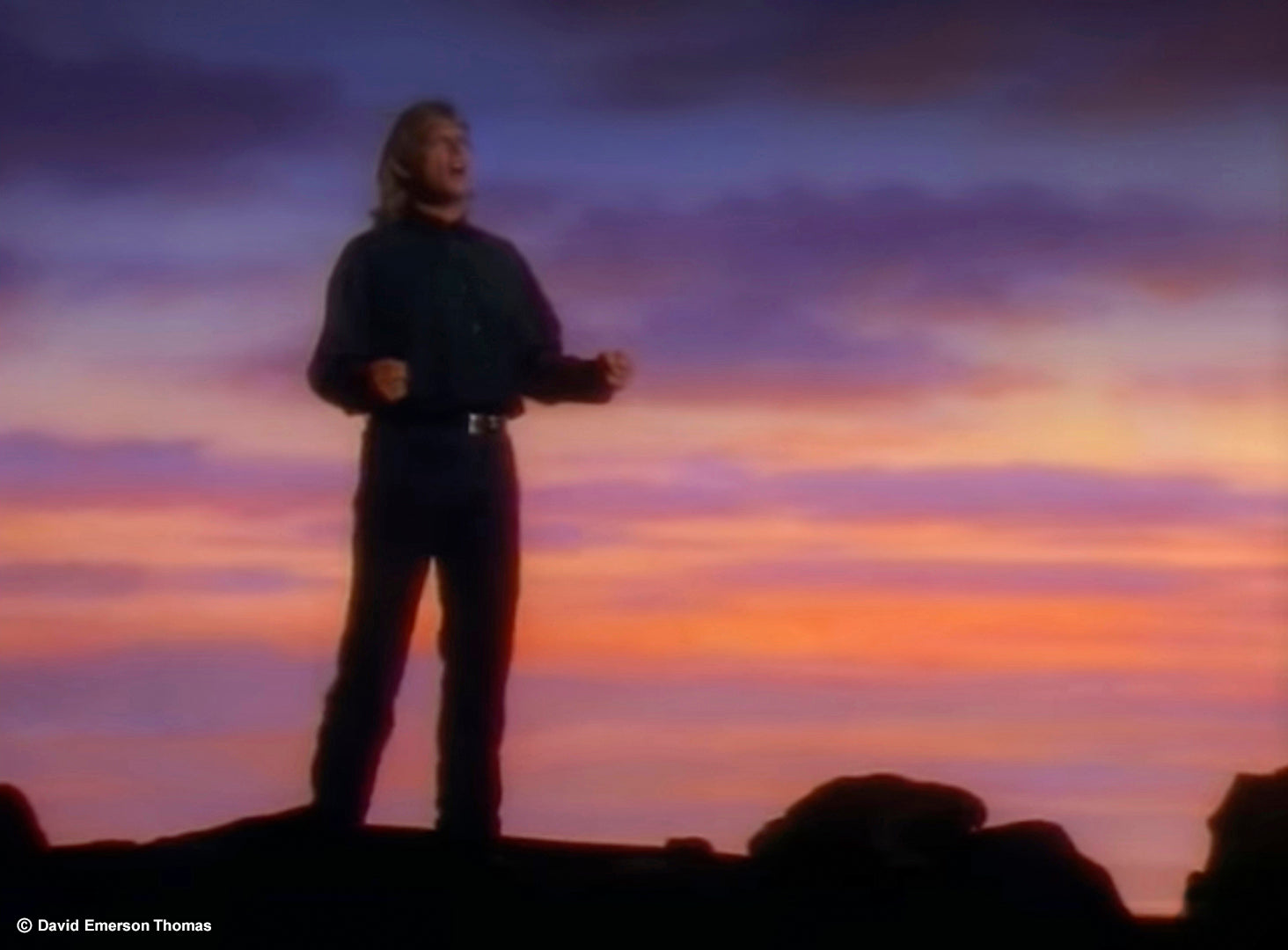 Music Video Still - Backdrop for Australian Icon John Farnham (Dramatic Sunset 01) airbrushed acrylic on canvas (20 metres x 5 metres) by Australian artist David E Thomas, 1993. Illusions Studio - Port Melbourne, Victoria, Australia